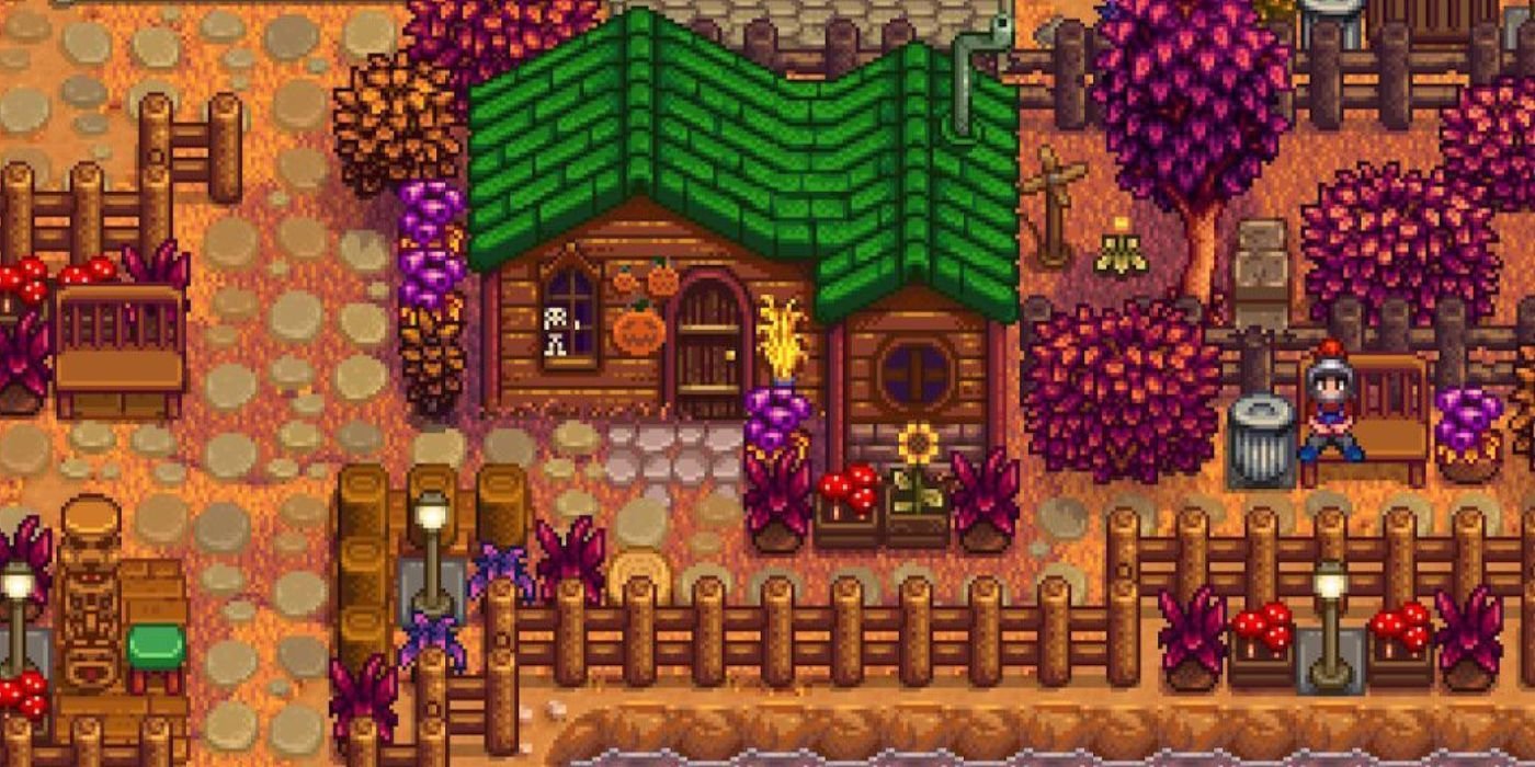 A Stardew Valley player sitting outside Leah's house