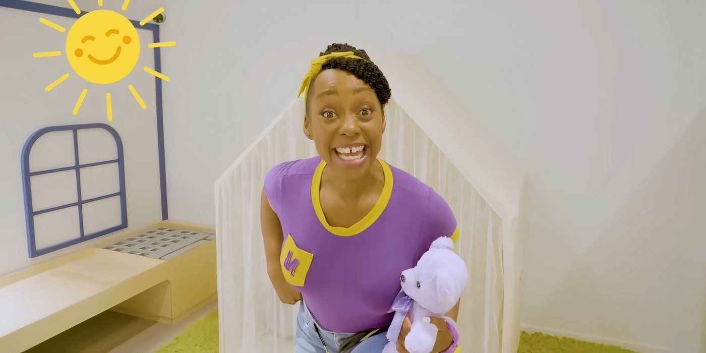 Cashae Monya as Meekah smiling and holding a teddy bear in Blippi.