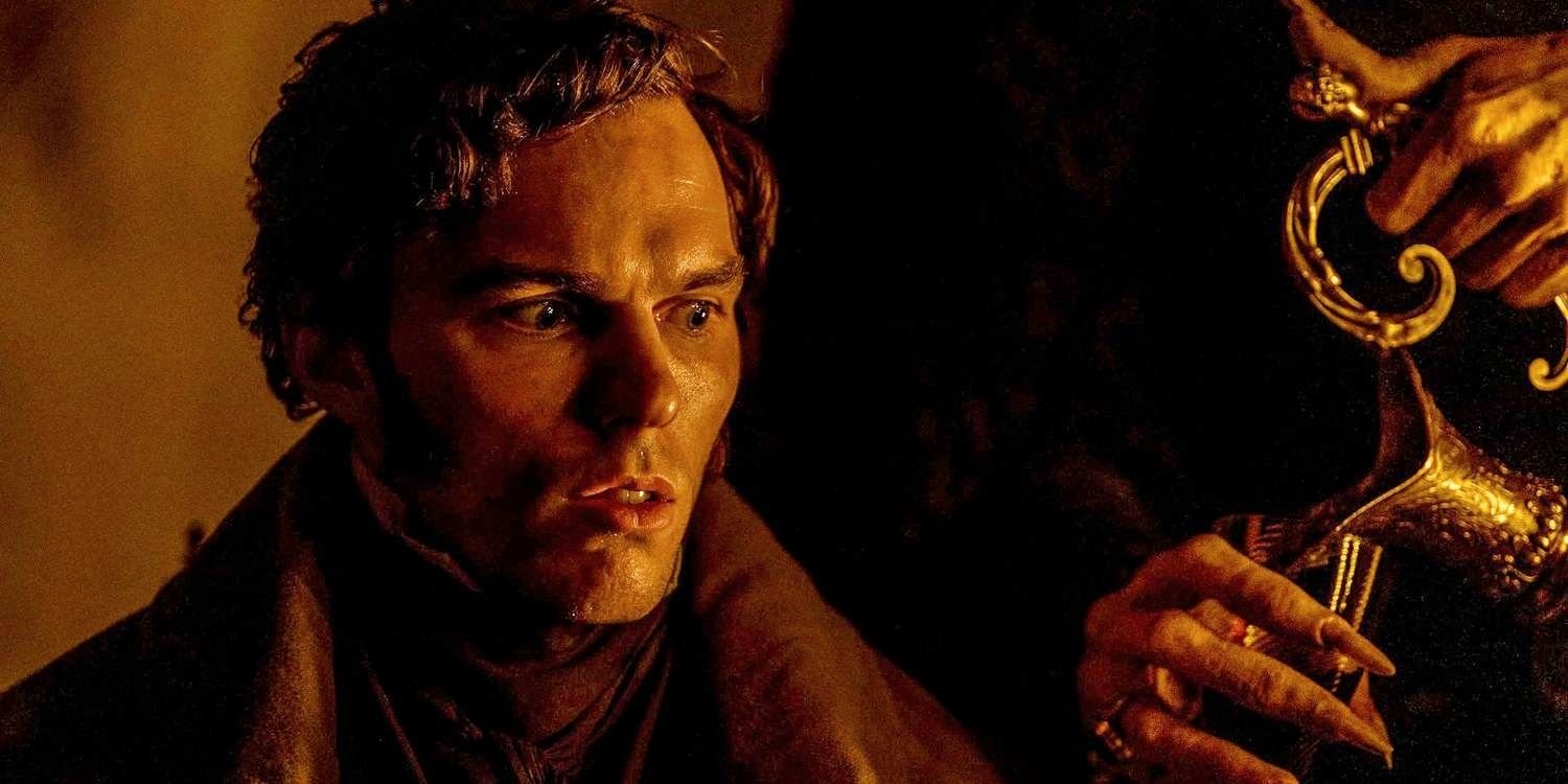 Thomas Hutter (Nicholas Hoult) shocked watching sinister hands pour him wine in Nosferatu